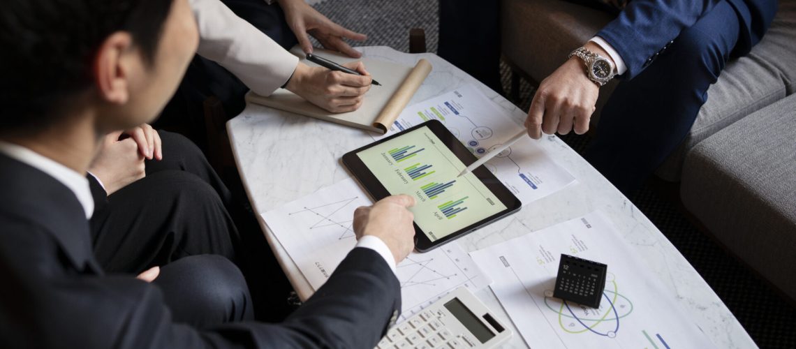 business-people-working-with-ipad-high-angle